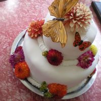 Dahlia Wedding Cake chocolate cake--ganache--cheesecake--ganache--chocolate cake-- buttercream--fondant; top layer is WASC with Ganache and Buttercream......