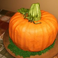 Pumpkin Yellow Cake with buttercream icing and fondant accents.