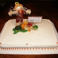 Fall Splendor This 1/2 sheet vanilla cake is covered with buttercream icing and decorated with fall accents and a personalized decorative sign.