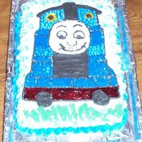 Thomas This is my second cake, I made it for my sons girlfriends little boy who loves Thomas. I am disappointed with the face. Somewhere between...