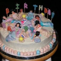 Sleepover this was fun to make... plastic mcdonald's polly pocket dolls with fondant sleeping bag.