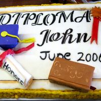 "with Honors" - Diploma Graduation Cake!! This is a 1/2 sheet cake covered in fondant and decorated with butter cream and fondant accents.