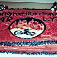 Harley Davidson Cake! This cake is covered in buttercream with rice paper images and decorative motorcycles.