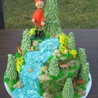 Hunter This was a groom's cake made for a Outdoor's Man! The cake is covered in buttercream and the trees are made of royal icing.