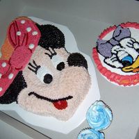 122314238140515.jpg Minnie and Daisy smash cake all buttercream.