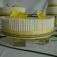 Cheesecake Devcorated With Chocolate Cigarellos These were the 'sheet' cheesecakes. I topped them with white chocolate ganache and covered the sides with white chocolate...