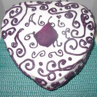 Eggplant 8" Heart In Buttercream With Petal This color was really difficult to achieve- I used a Tube of Wilton's premade red mixed with an equal portion of my reg buttercream...
