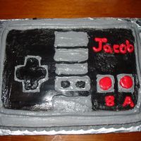 Original Nintendo Cake I made this for my brother in laws 21st birthday party- the black is actually a very very dark cocoa buttercream frosting that tastes...