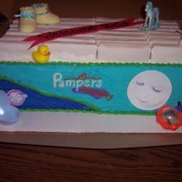 Pampers (Boy) 2 9x13 cakes stacked icing with BC edible image photos. Diapers are banana twins wrapped in fondant. Other decorations are plastic that I...