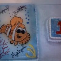 Finding Nemo this is a half sheet strawberry cake with a 6'" cake for the birthday boy to enjoy by himself. I used color mist for the blue and...