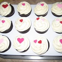 Some Chocolate Cupcakes W/ Cream Cheese Icing And Candy Decorations 