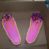 Flip Flops Yellow cake, buttercream icing, fake flpwers , candy on side is runts and then straps are fruit roll ups... :) thanks for looking