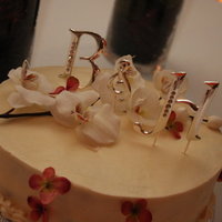 Brother's Wedding Cake Carrott Cake with cream cheese frosting. Used vases for the stands.