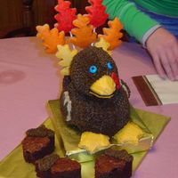 Turkey Cake Used duck pan. Don't use to many cookies (feathers), his hind end will fall off. Made acorns from brownies...