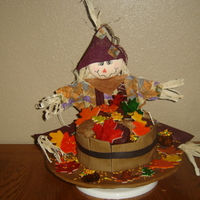 Fall Cake Chocolate cake w/raspberry filling. Chocolate icing topped with fondant leaves, red velvet and cinnamon cupcakes. Barrel made of fondant...