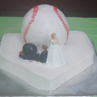 Homerun This is a groom's cake. The groom loves baseball. The home plate is carved and covered with buttercreme. The baseball was done with...