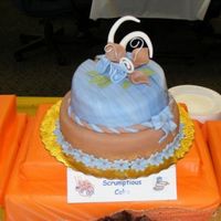 Simple Cake Covered with fondant and moist with Rum. I made the cake for the Chili and Bake cook off at work to raise funds for the Junior Achievement...