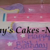 Hannah Montana Guitar Chocolate and vanilla cake. Some fondant pieces. Fishing string for the guitar strings.