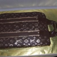 Brown Lv Cake painted on design with gold pearl dust. Next attempt will be a standing 3D purse