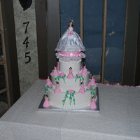 La Quinceanera Cake This was a pina colada cake with pina colada filling and buttercream frosting and flowers.