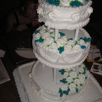 Wedding Cake This was a carrot cake with cream cheese frosting. Roses are made of royal icing. Very heavy cake!!
