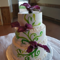 Handpainted Wedding Cake This is a cake that is alternating layers of white and chocolate cake with raspberry filling and buttercream icing and trim. The vines and...
