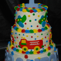 Fire Trucks And Airplanes I enjoyed making this cake. My first time to cut fire trucks and airplanes and assemble them for a cake. The top and bottom tier are white...