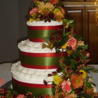 Fall Wedding Cake This was for a wonderful friend of mine. The cake is french vanilla with bc icing. the flowers are real with burnt orange and green ribbon...