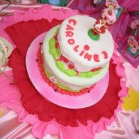 Strawberry Shortcake Fondant covered. Bottom half chocolate with caramel filling, top orange cake with lemon ganache frosting - was too liquid so it melt and...