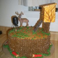 Deer Hunting On A Tree Stump Two layer chocolate cake with oreo filling. Iced in BC. I used a milk carton covered in MMF for deer stand and dowels glued together and...