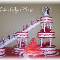 6 Tier Wedding Cake With Fountain & Stairs Red White Roses With Scroll Design This turned out to be one of my Favorite cakes I've ever made! I put Alot of time and effort into it. The scroll work thru the middle...