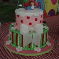 Strawberry Shortcake Birthday Cake Bow and flowers are made from gumpaste and covered with pearl shimmer dust. I copied this idea from a sweet lady on here but I don't...