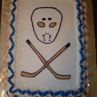 Father's Day Cake Skull & cross bone theme using a hockey mask & crossed hockey sticks.My hubby is a HUGE hockey fan, so I searched for hockey images...
