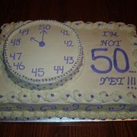 49Th Birthday Cake for 49th Birthday party. The theme is "I'm not 50....yet!!!" The small hand on the "clock" is on the number...