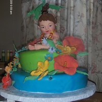 Hawaiian Baby Shower baby made of gum paste, white cake with peaches!