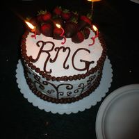 German Chocolate Cake I made this for my husbands 25th bday, and it is a 2 layer german choco cake with white buttercream, and chocolate dipped strawberries. my...