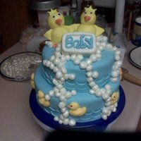 Rubber Ducky You're The One... This was a baby shower cake for a coworker. My first time with MMF. The 2 ducks on top and the bar of soap are made out of rice crispe...