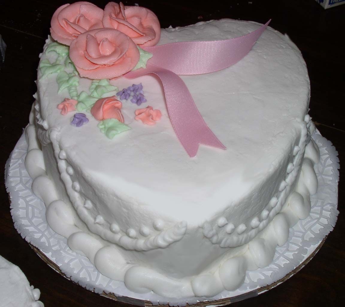 One Of The Two Heart Shaped Side Cakes For The Pink Roses Buttercream Cake This was one of the two heart shaped cakes. I finished the top border after I got it to the wedding. They loved them.