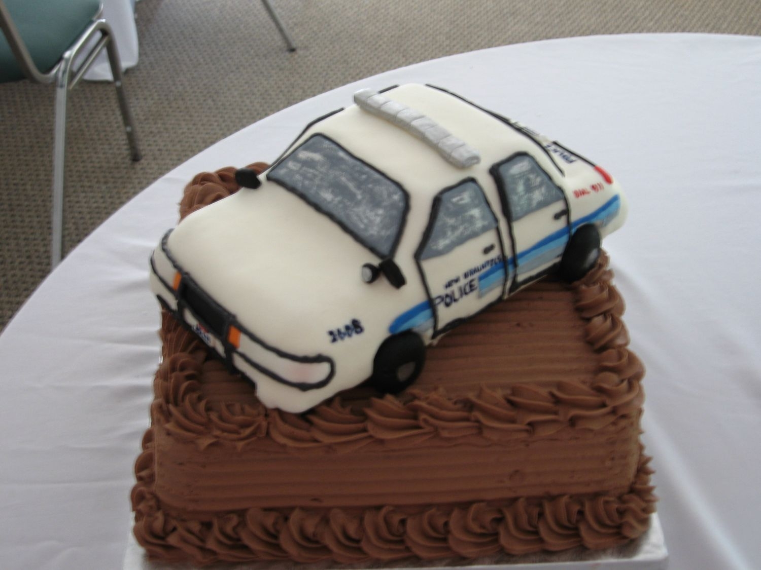 Police Car Cake This car is modeled after the groom's actual police car. I had every detail included. Even down to the EXEMPT on the liscense plate.