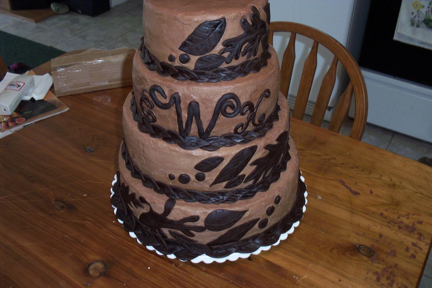 Choc. Wedding Cake Fall wedding cake. Bride found cake from a magazine and asked me to replicate it. Not happy with it being unsmooth. The bottom did not make...