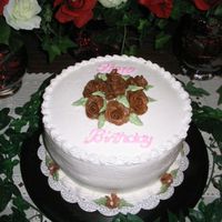 Mom Birthday Cake This is one of my first. The roses are made of tootsie rolls. The cake is made of Chocolate Chocolate cake with cherry filling, Buttercream...