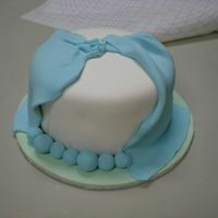 My First Fondant And Gumpaste Class Cake This cake was an absolute nightmare! The fondant kept tearing (I rolled it way too thin. Luckily drapes can work wonders at hiding things...