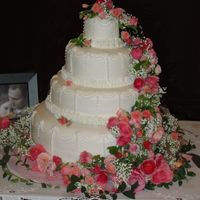 Kyle And Megan's Wedding White cake, vanilla-almond butter cream with faux fondant frosting. 16, 12, 8, 4" layers. My nephew and his fiance asked me to make a...