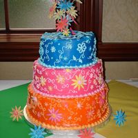 Flower Power Sweet Sixteen Covered in fondant with buttercream, fondant, and gumpaste accents, this cake was for an Andy Warhol/hippy themed sweet sixteen.