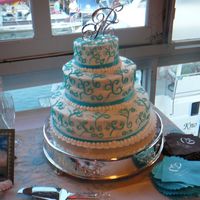 Aqua Wedding Cake This is the second wedding cake I've made. I made this one for my husband's daughter. She used aqua and brown as her colors....
