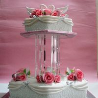 Silver Anniversary Cake Edible swans made from sugar.