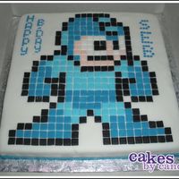 Megaman! Megaman cake for my friend's fiance.Everything is fondant except for the writing, which was just piped BC.