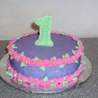 Lydia's Smash Cake This was a smaller cake for Lydia to "smash". I purchased the number 1 from the store but it didn't match...so I piped royal...