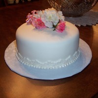 Happy Mothers Day Yellow cake with fondant, silk flowers so the Mother could wear it a coursage.