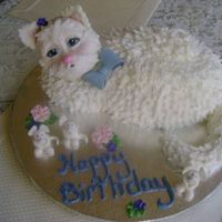 Cat And Mouse The cat's body is buttercream, and her head is fondant. The mice are also fondant. Thanks for looking!